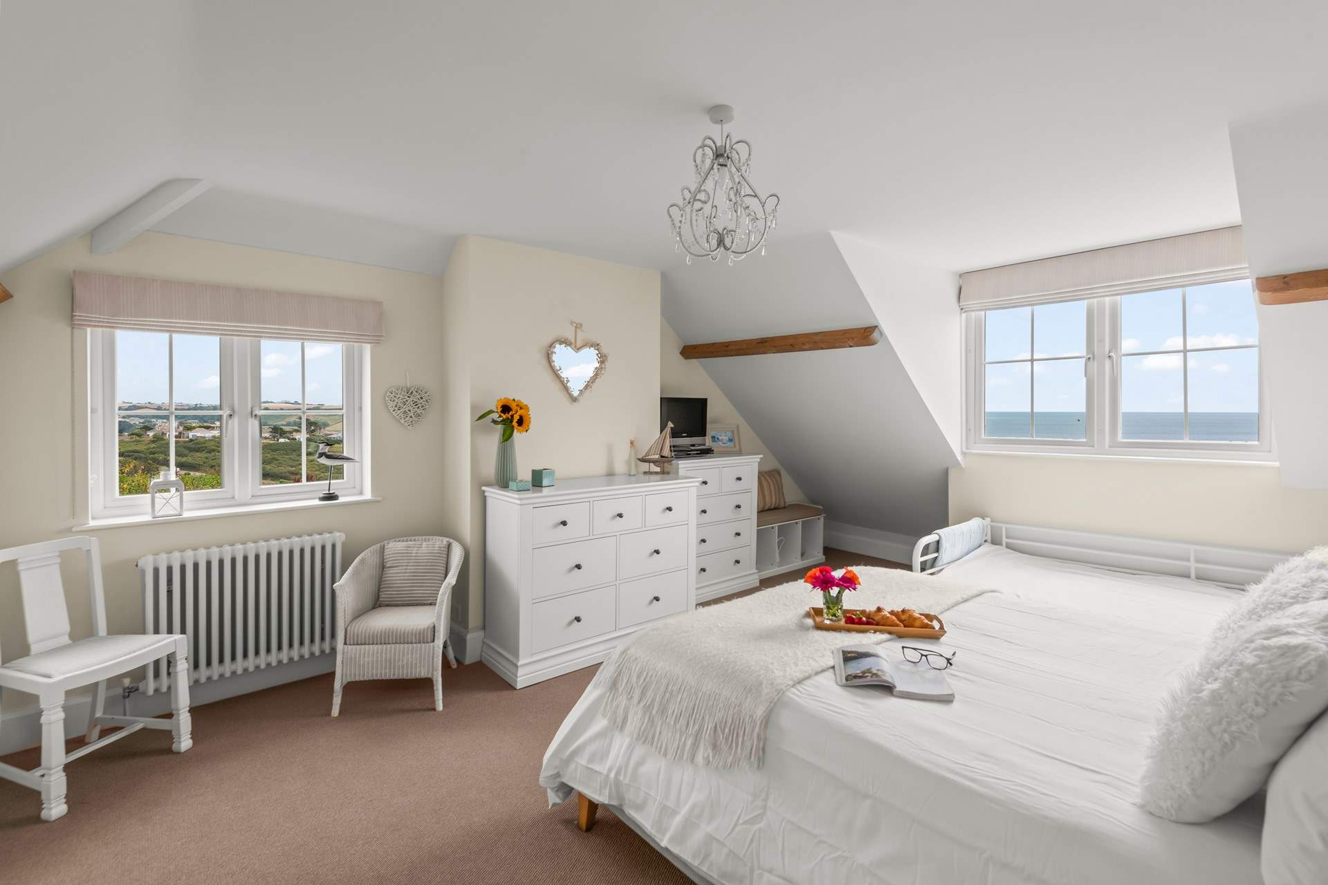 Bedroom 1 is super sweet and spacious. Please mind your head on the sloping ceilings.