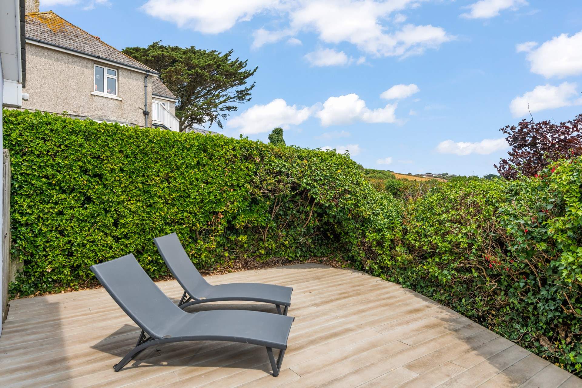 Tucked away around the corner you have a secluded space where you can enjoy the sun on these loungers.