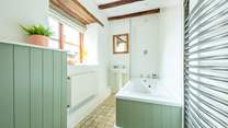The family bathroom offers a bath for those long holiday soaks and a refreshing shower to wake you up in the morning.