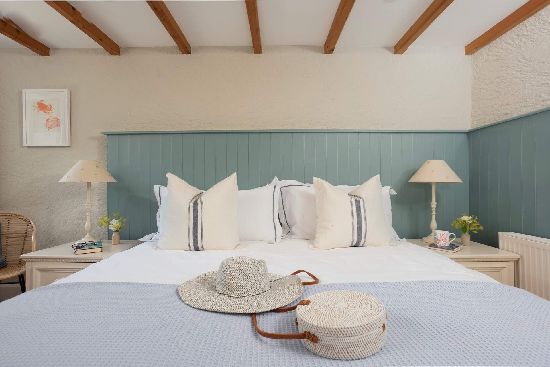 A comfortable king-size bed in bedroom 1.