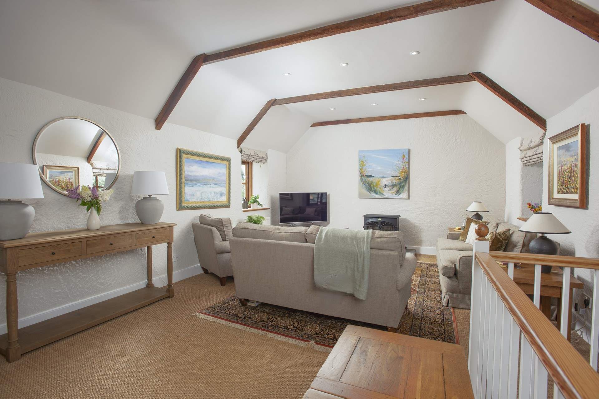 The sitting-room offers plenty of room for all.