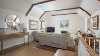 The sitting-room offers plenty of room for all.