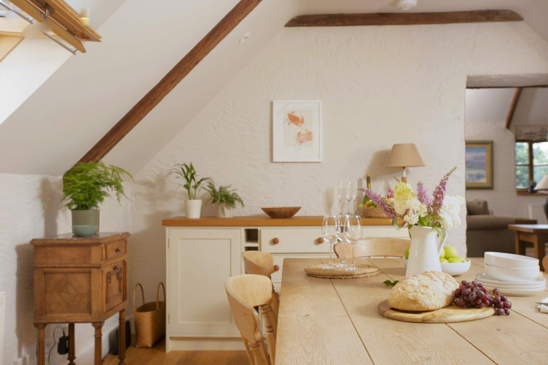 The country style kitchen/dining-room perfectly complements the surroundings. 