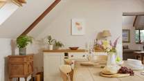 The country style kitchen/dining-room perfectly complements the surroundings. 