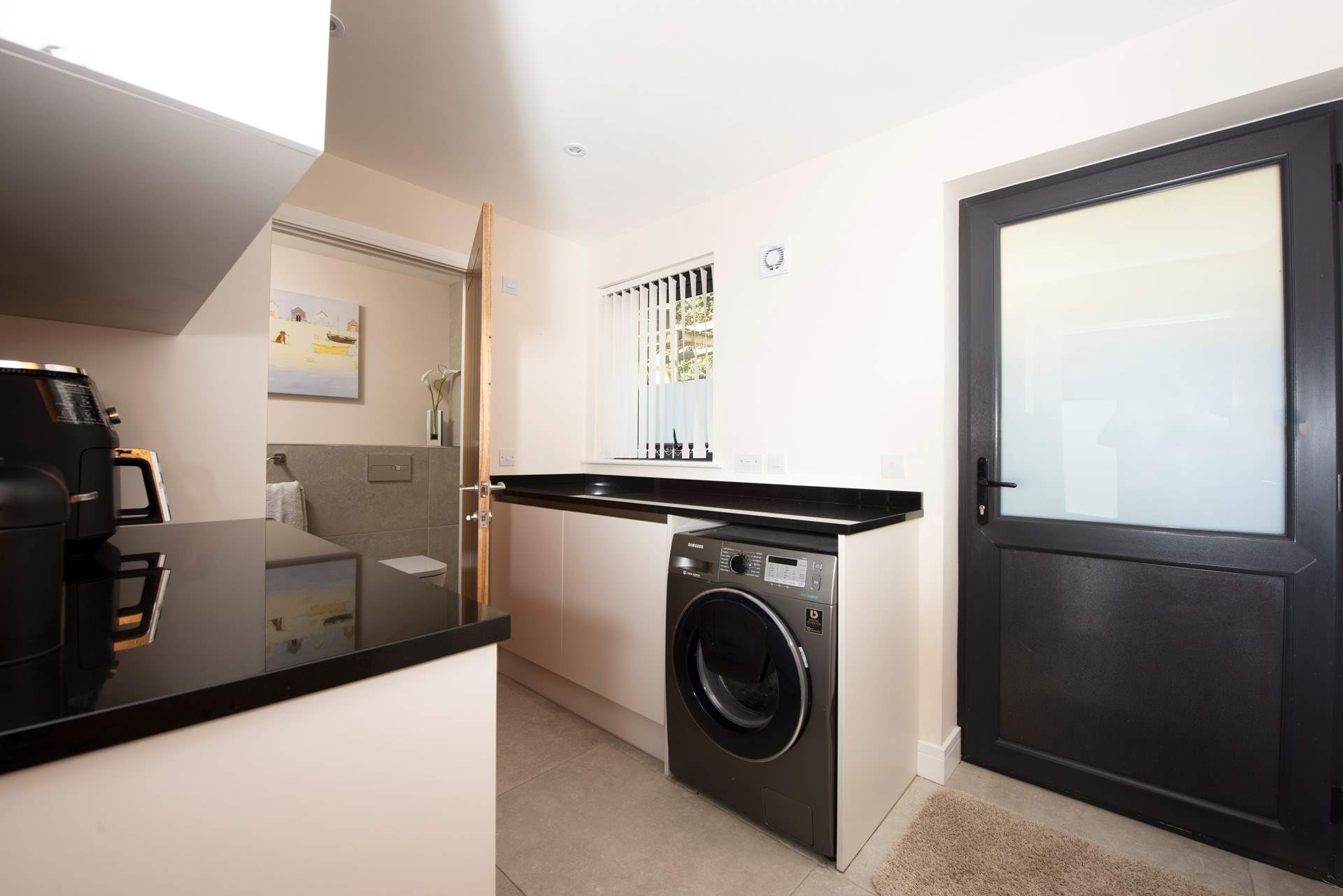 The utility space is parallel to the snug and has a handy WC and wash-basin.