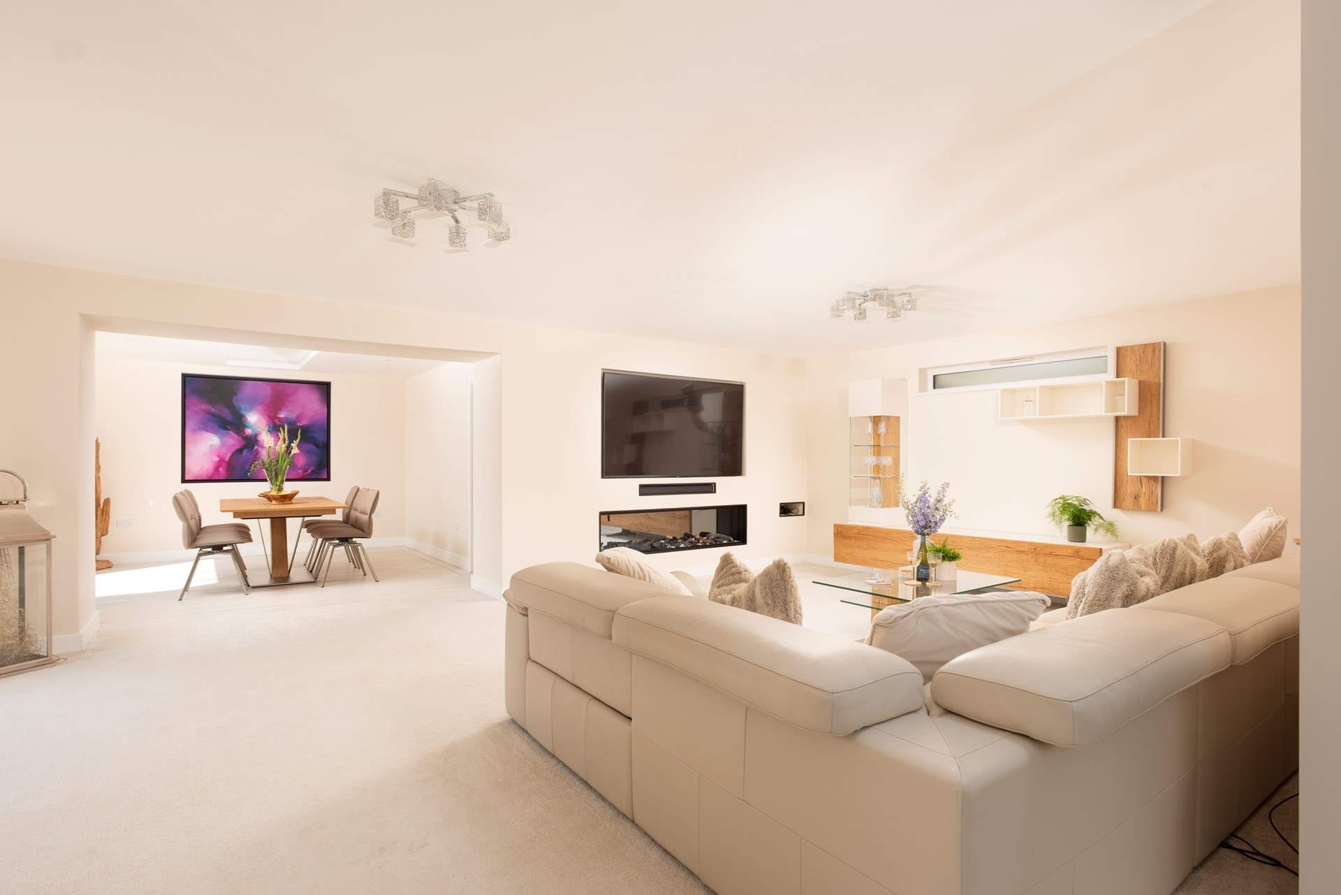 The sitting-area has an enormous sofa and Smart TV.