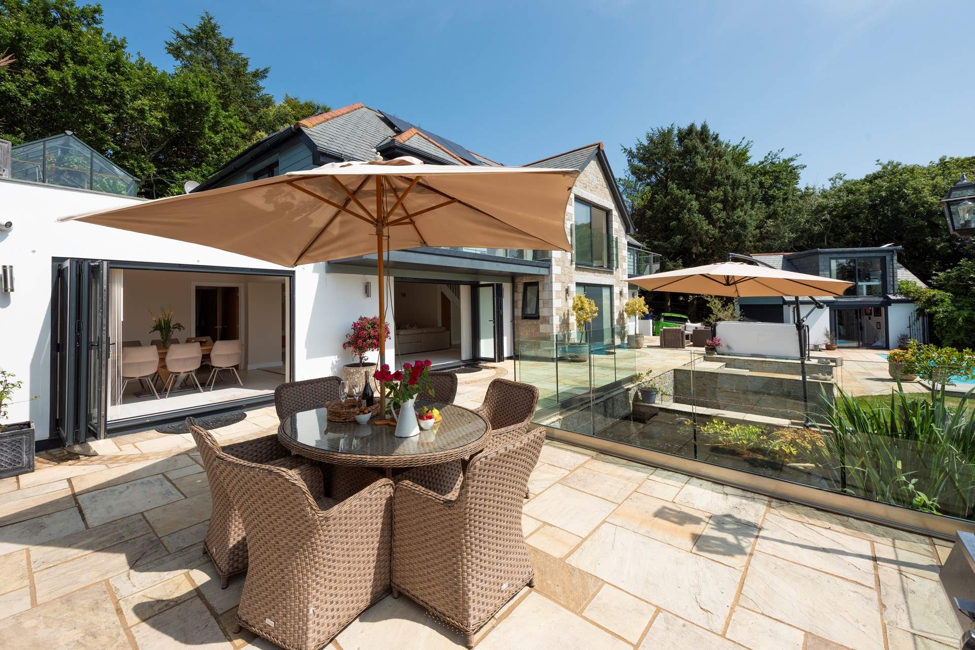 The al fresco dining-area looks over the gorgeous gardens.