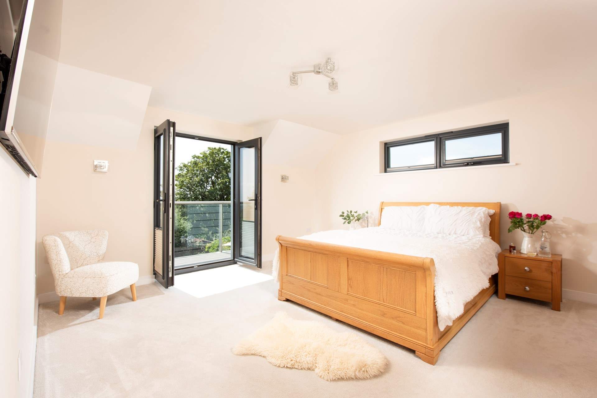 The principal bedroom features a private balcony.