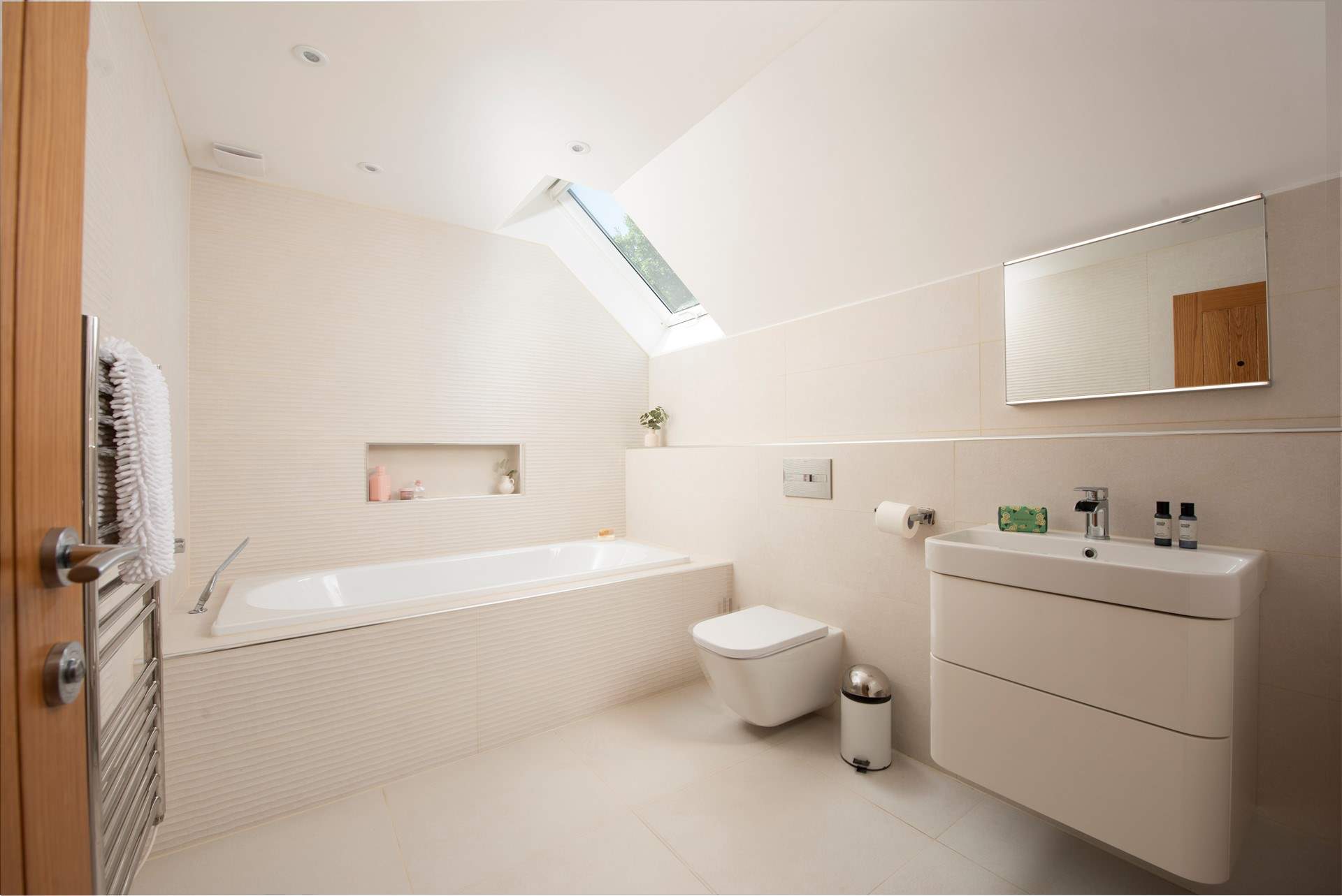 The family bathroom on the first floor boasts a large bath.