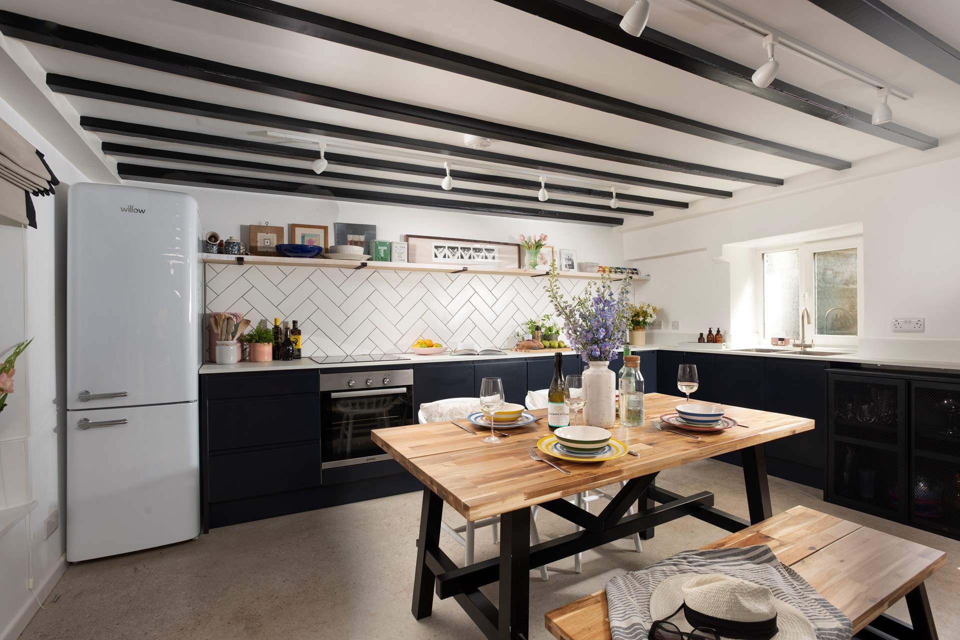 Practical chic polished floors and beautiful beams set the scene.