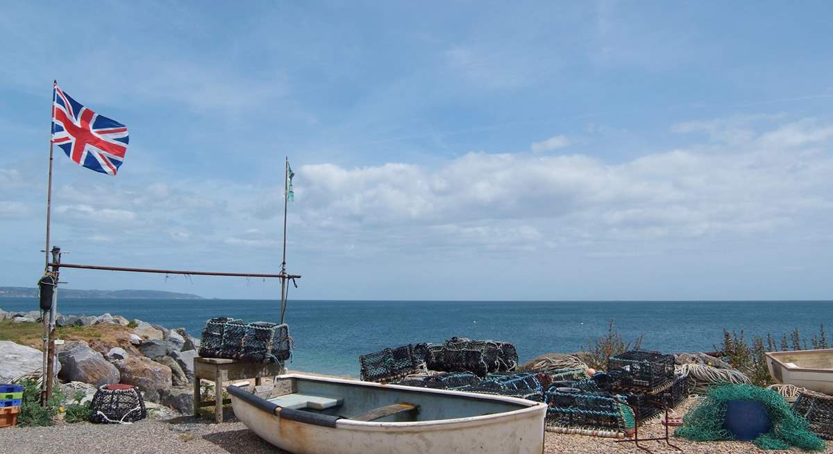 Boats and lobster pots on the beach at Beesands.