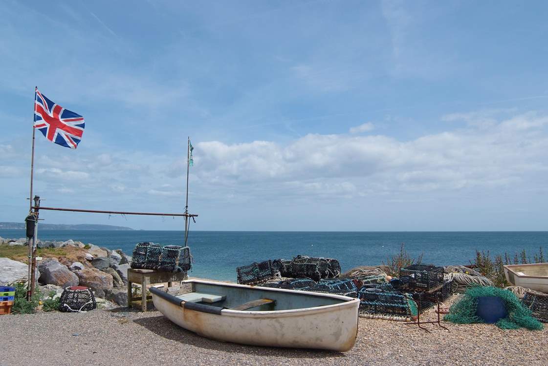 Boats and lobster pots on the beach at Beesands.