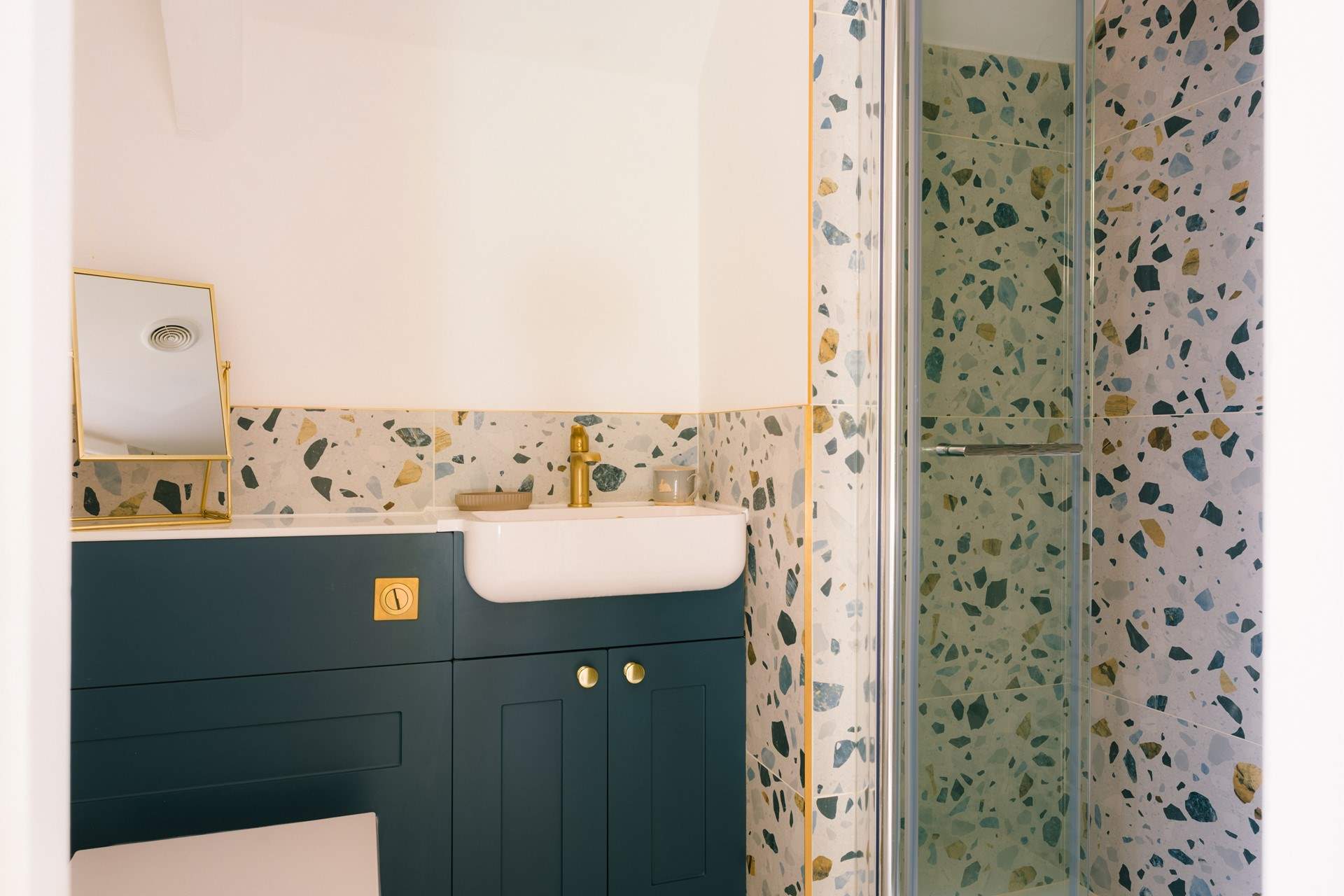 Bespoke styling choices and a large shower enclosure with a rainfall shower head - perfect for a refresh after a busy day exploring.