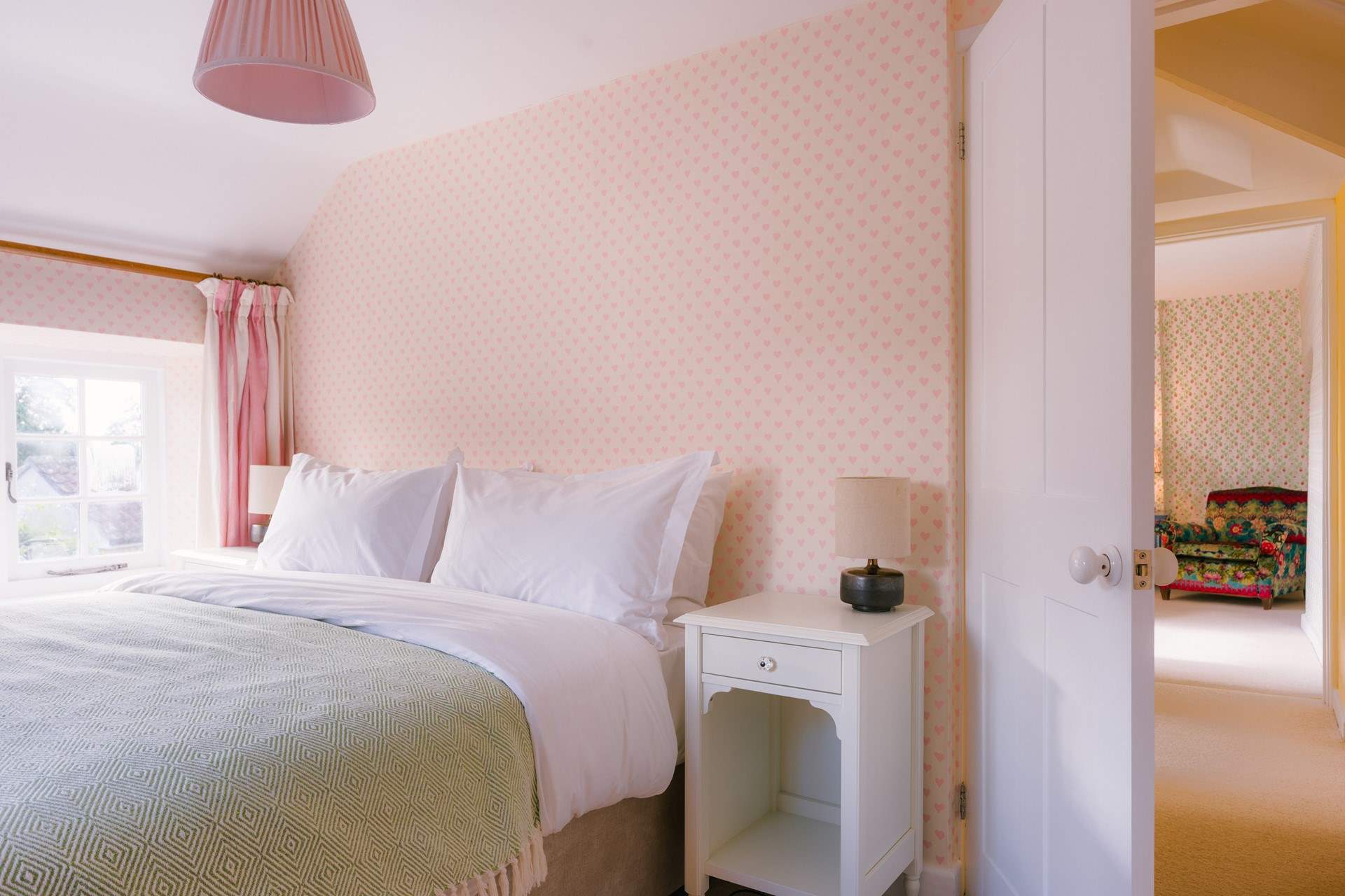 The king-size bed and soft styling make for such a relaxing space.