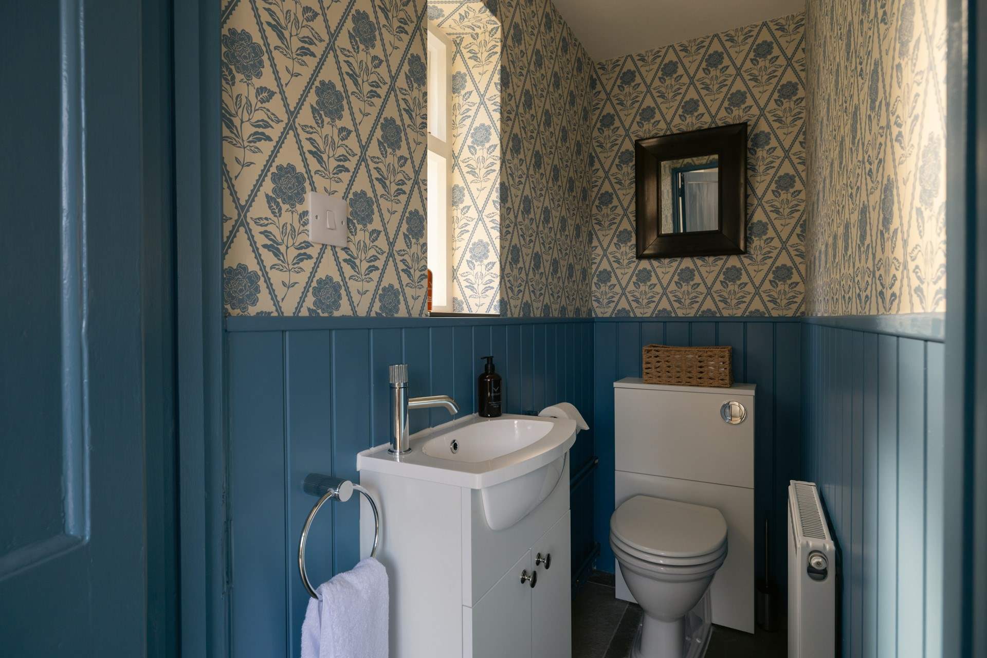 What a pretty cloakroom leading off the hallway.