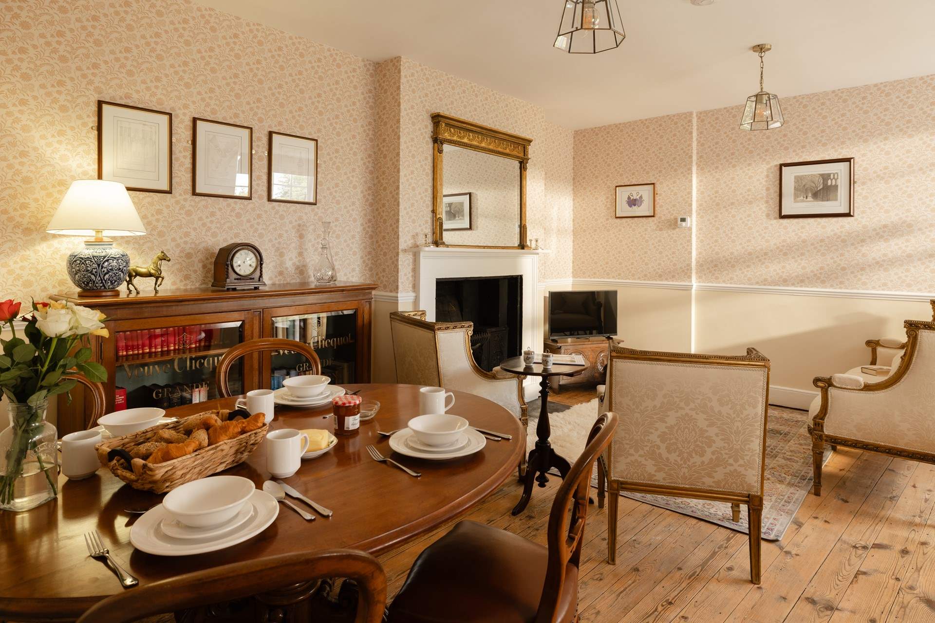 Antique furniture graces the sitting/dining-room.