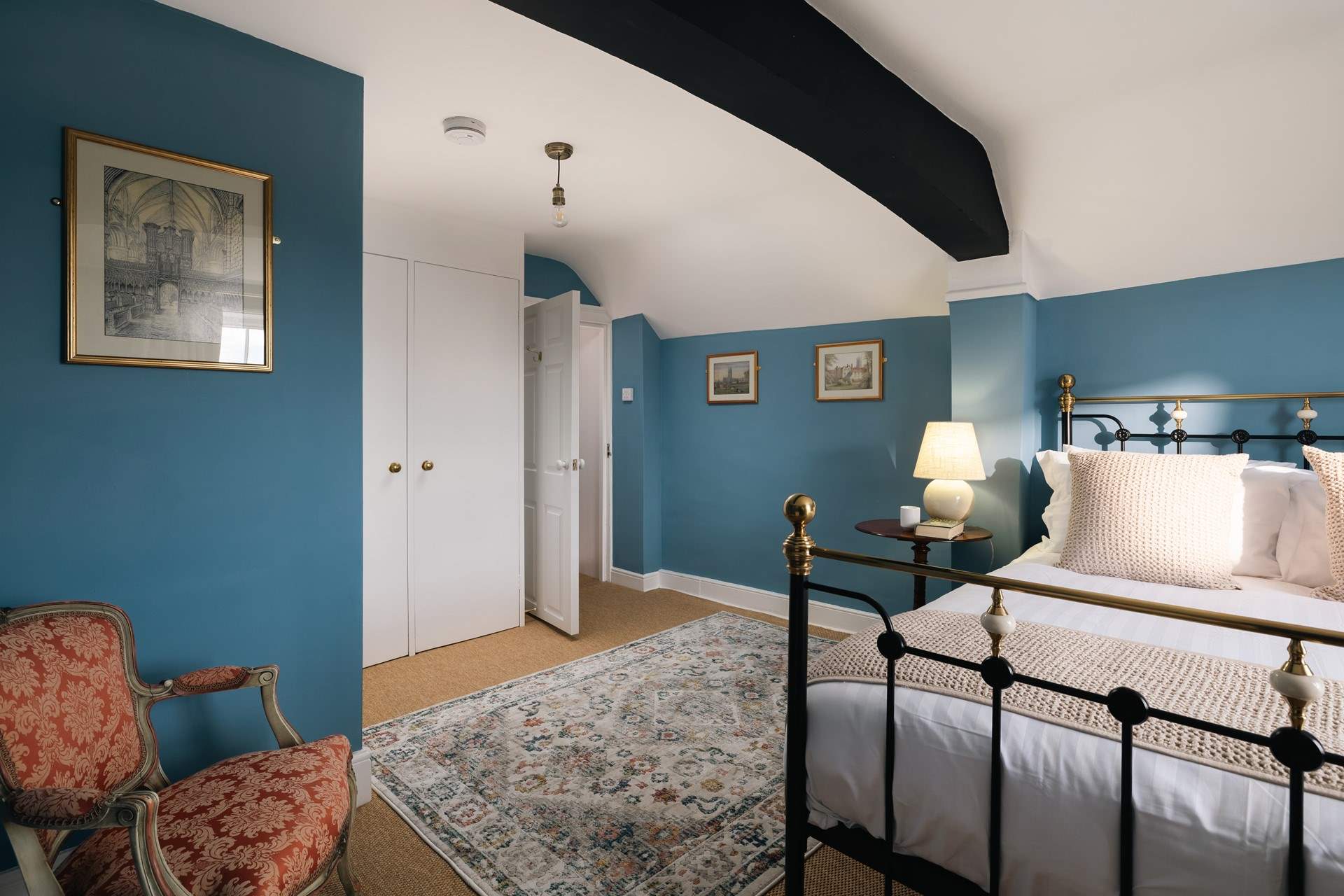 The top floor bedroom is beautifully styled.
