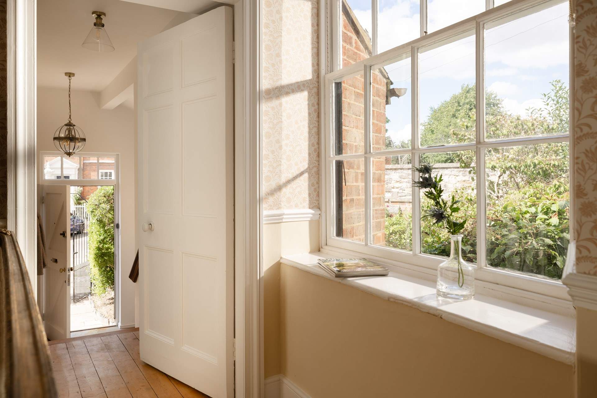 The sitting-room window is large and lets in the sun.