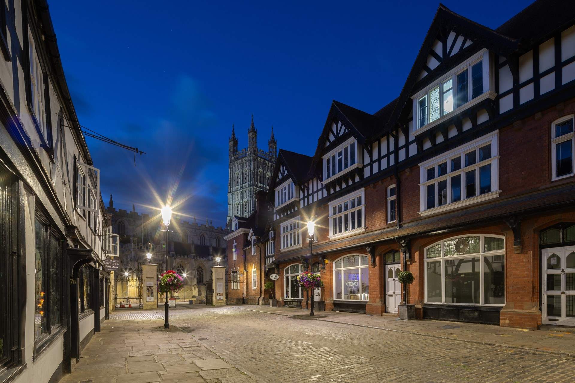 The approach to the cathedral in the evening light. On the left you will find the Beatrix Potter 'The Tailor of Gloucester' shop. 