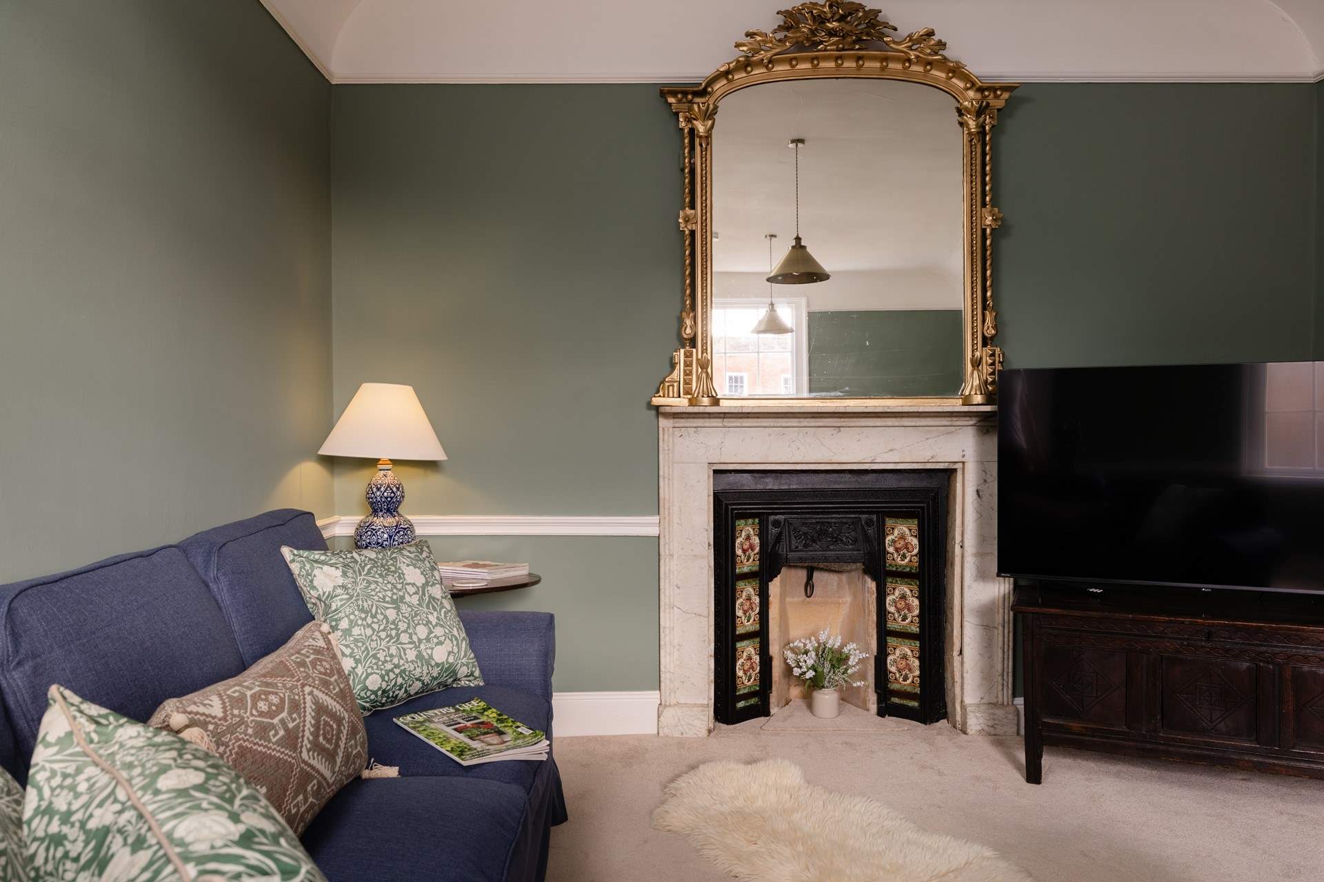 Up a few steps from the dining-room you will find the sitting-room, large and spacious with room for all the family. 