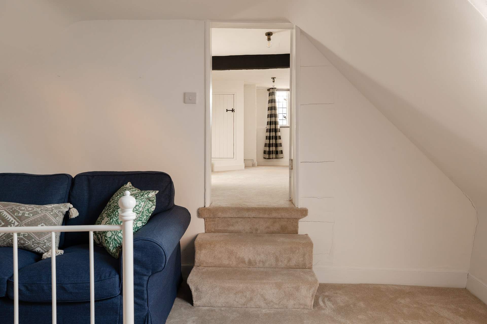 Steps down to the double bedroom. 