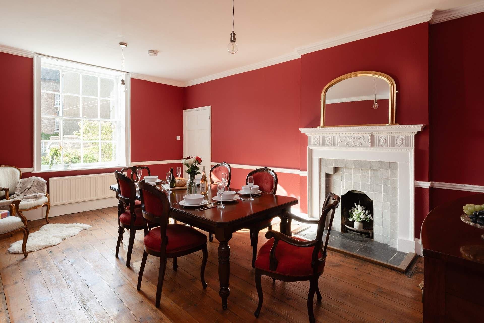 The Eddison lighting adds a contemporary touch to this elegant dining-room.