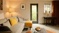 The cosy sitting-room has been styled for relaxing.