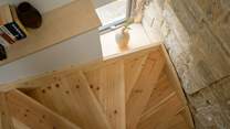 The bespoke staircase leads up to the bedrooms.