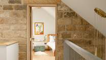 The galleried landing has a bedroom at each end.