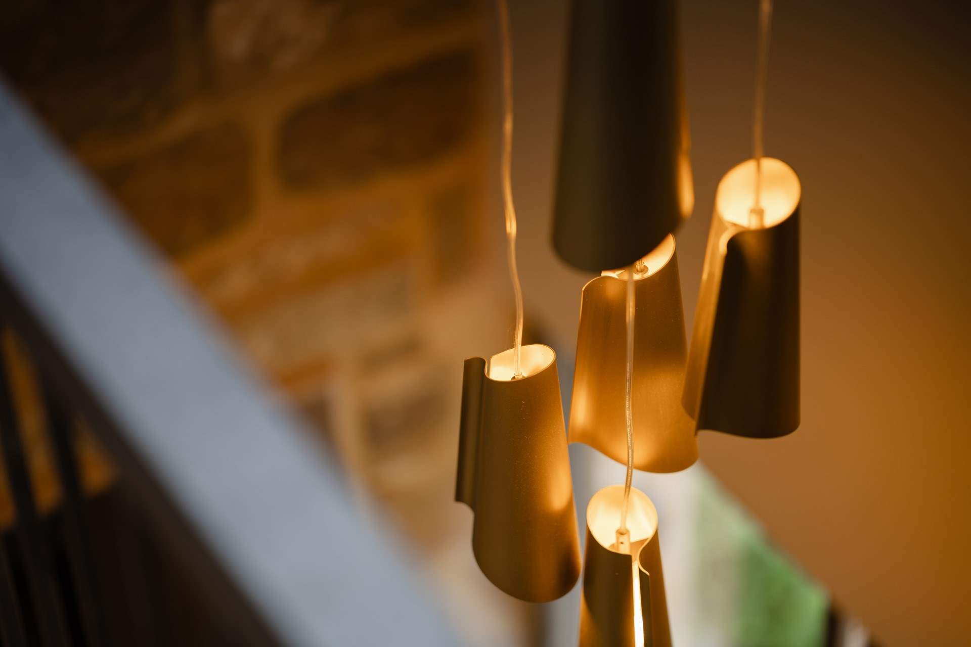 Look past the statement lighting to the hallway below.