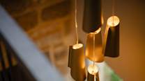 Look past the statement lighting to the hallway below.