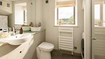 The ground floor shower-room also houses the washing machine.