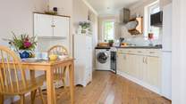 The cute kitchen is well-equipped.