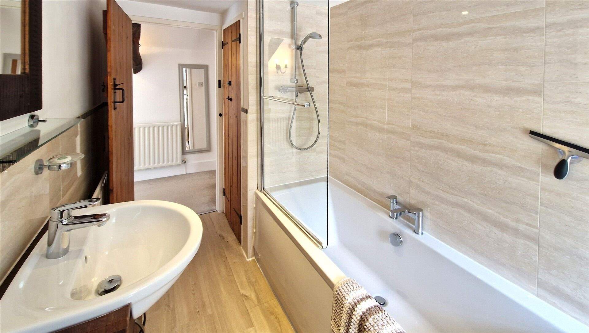 Choose from a refreshing shower or a leisurely soak in the family bathroom.