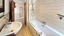 Choose from a refreshing shower or a leisurely soak in the family bathroom.
