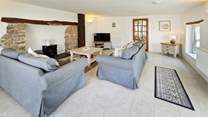 The sitting-room has plenty of space for everyone including the family pooch.