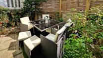 Enjoy al fresco dining in the secluded garden.