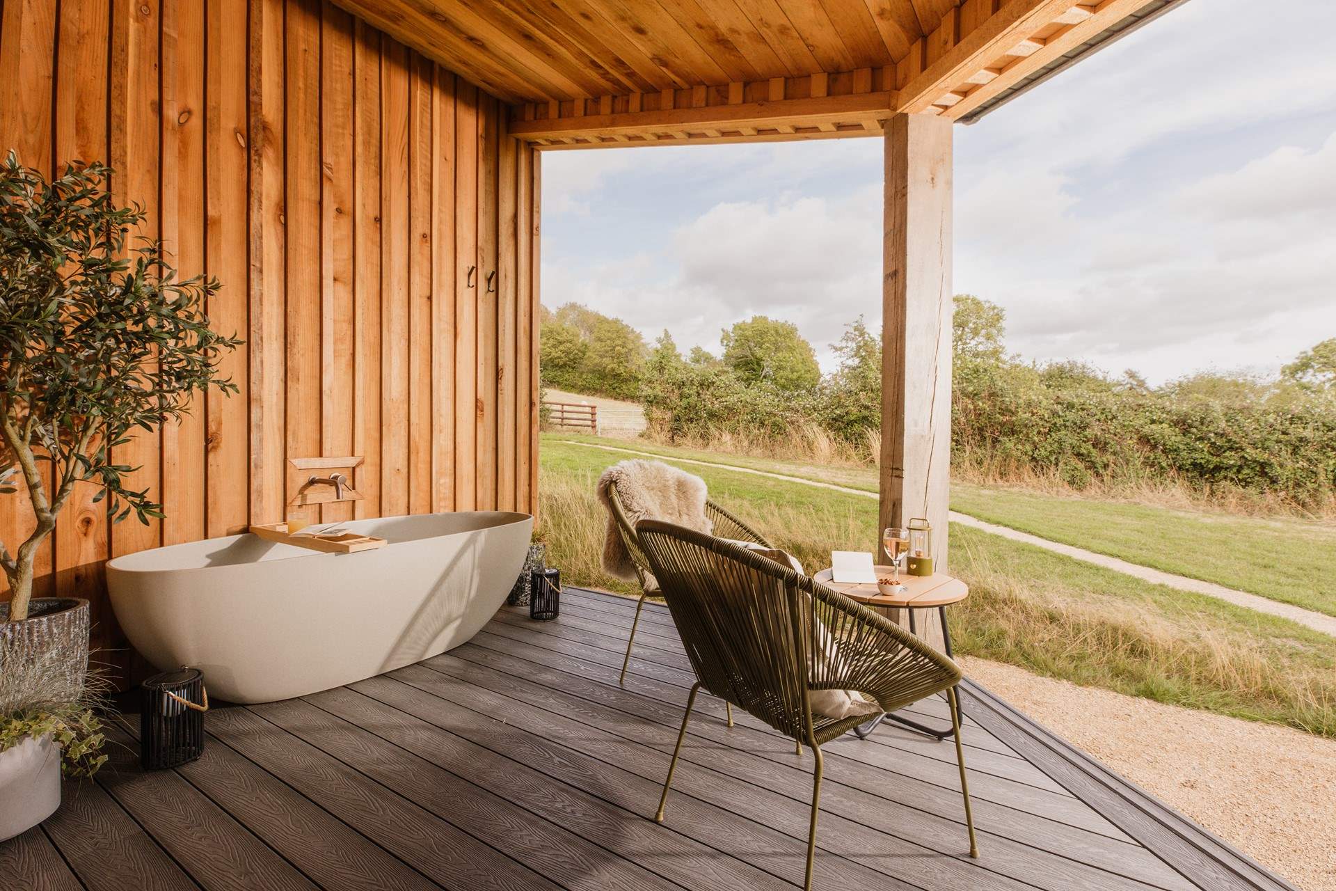 Enjoy countryside views from the soothing depths of the outdoor bath.