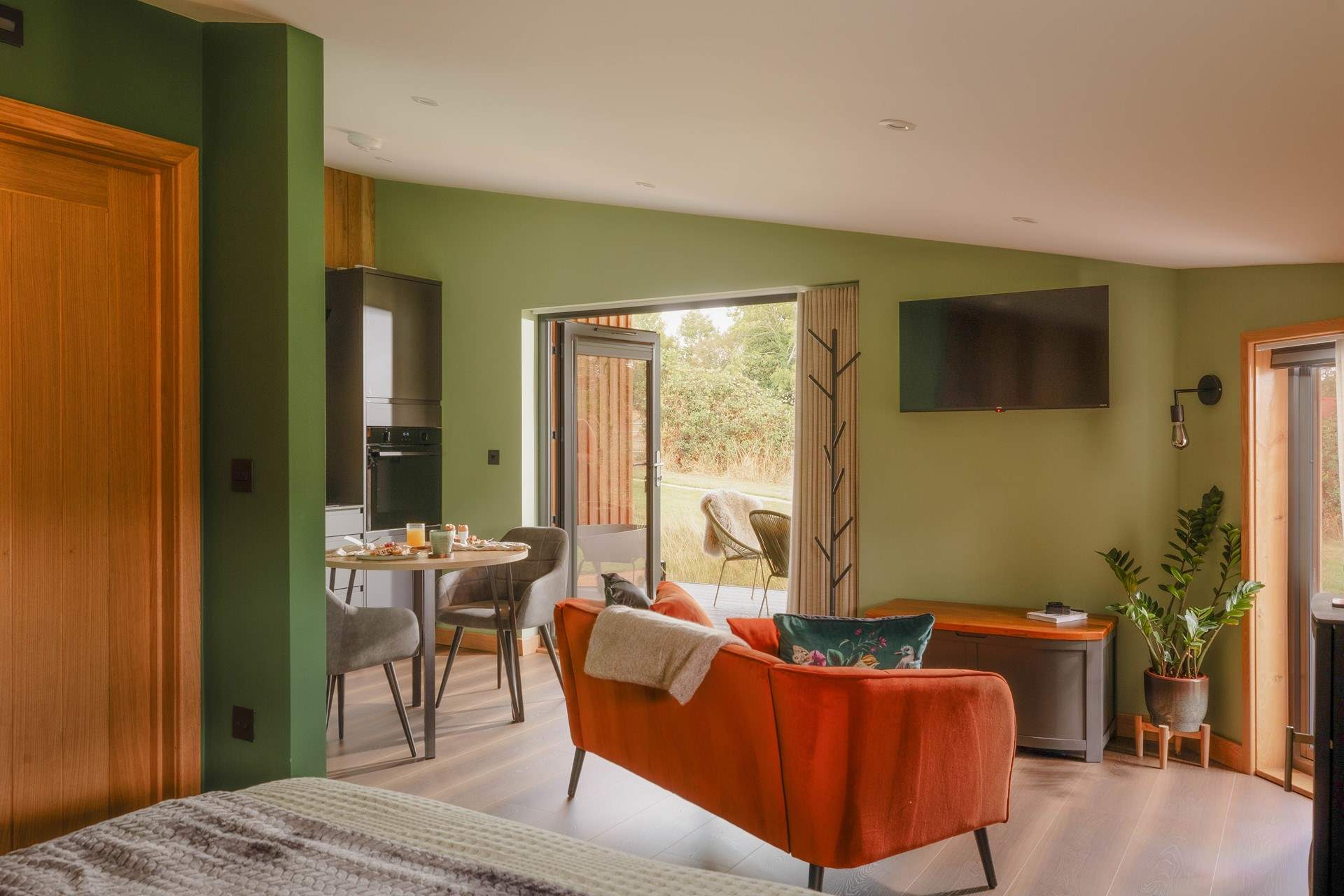 The beautiful light-filled living space full of earthy tones. 