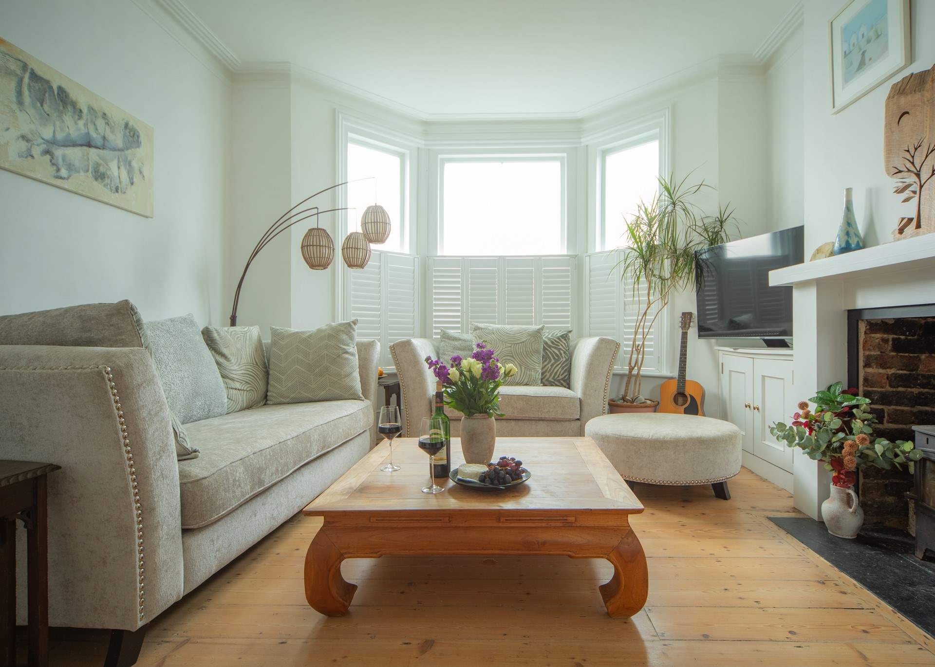 This living area combines comfortable furnishing with traditional features.