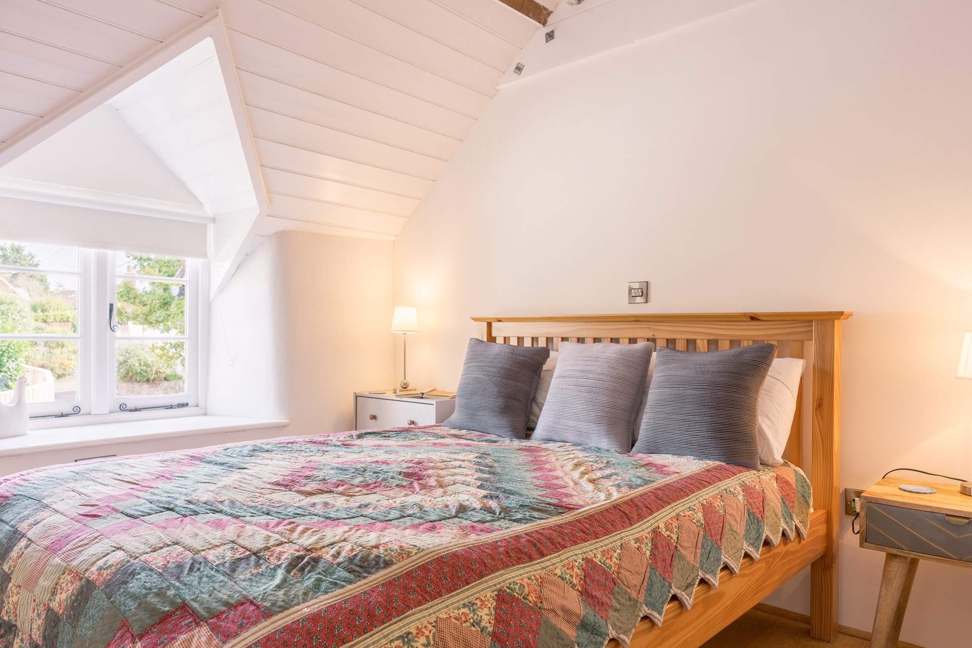 The calm, pared back feel continues into the large second bedroom.