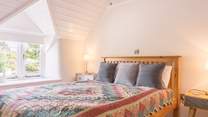 The calm, pared back feel continues into the large second bedroom.