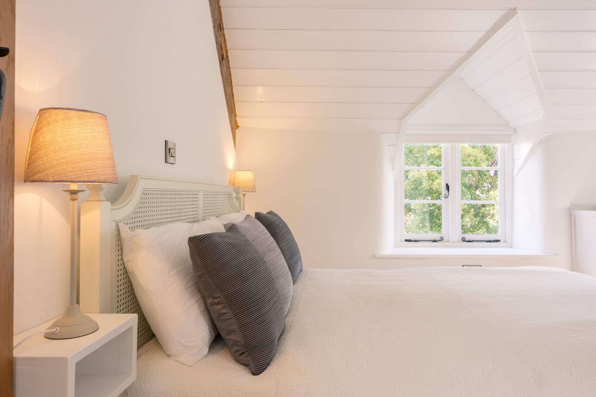 The primary bedroom is pared back, light and calming - a very good night's sleep is on the menu here.
