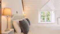 The primary bedroom is pared back, light and calming - a very good night's sleep is on the menu here.