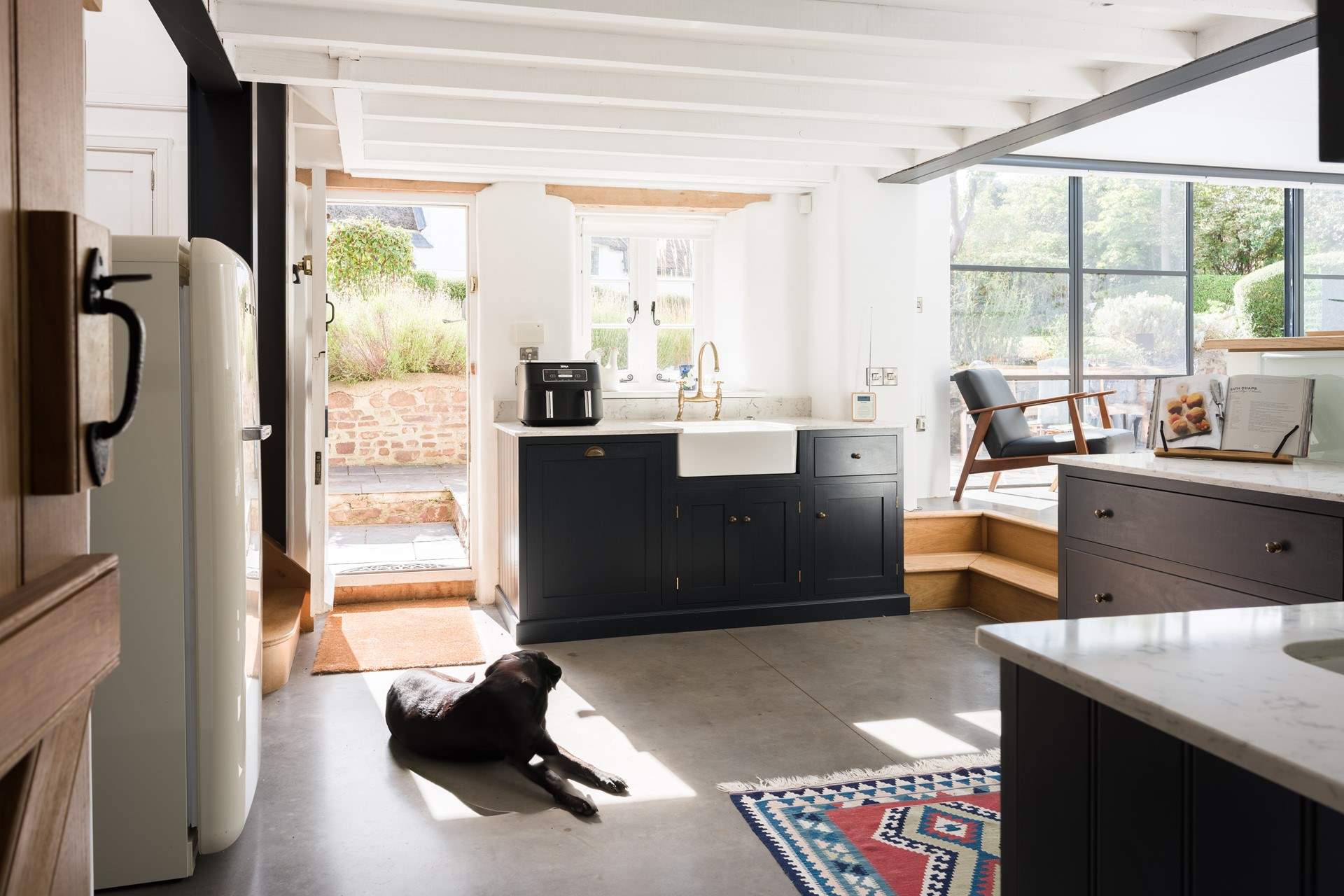 The kitchen is beautiful. Lots of prep space and all the appliances you would expect to find in such a lovely cottage. The traditional stable-door leads straight out to the garden.