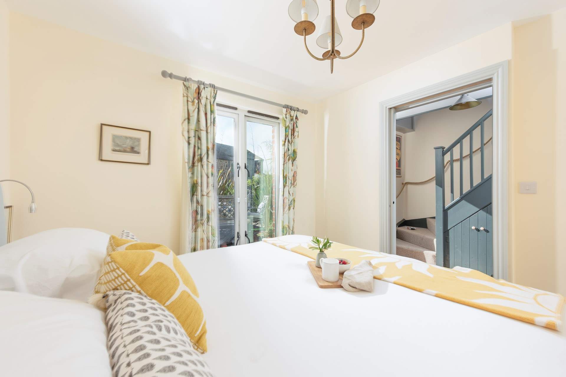 Beautiful bedroom 1 has a super-king size bed and patio doors which lead onto the deck area. 