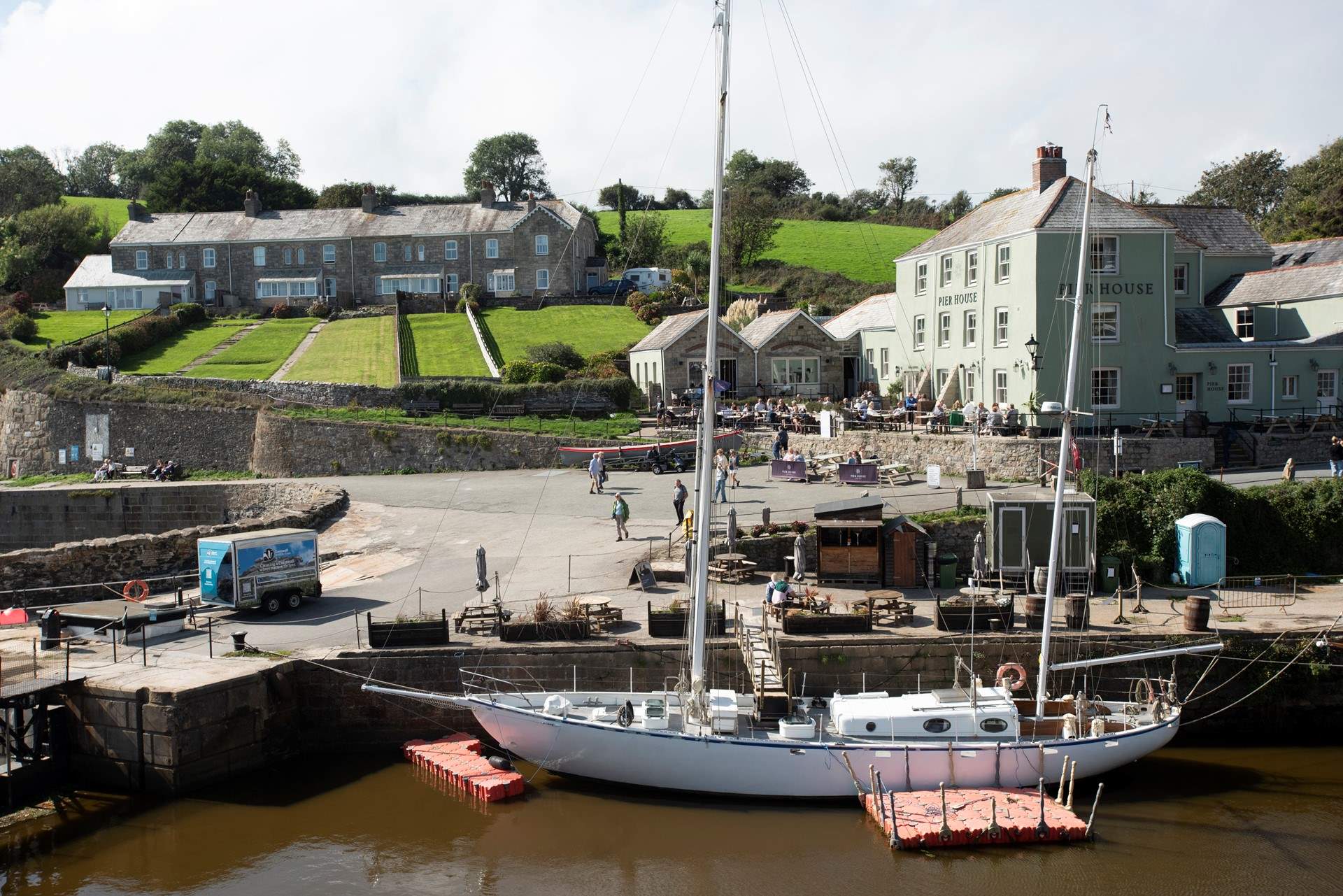 See the boats moored in the harbour. 
