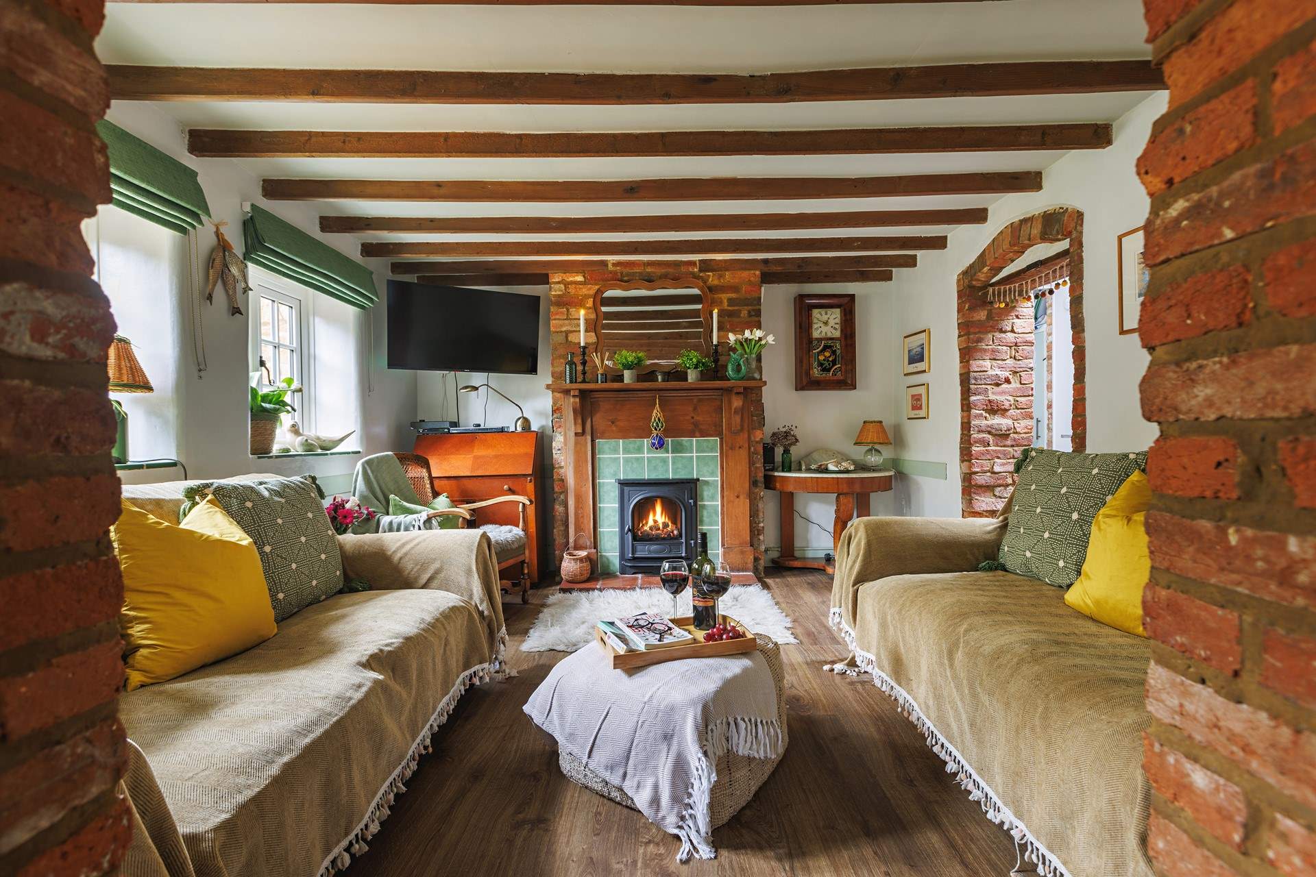 The characterful sitting-room with warming gas fire.