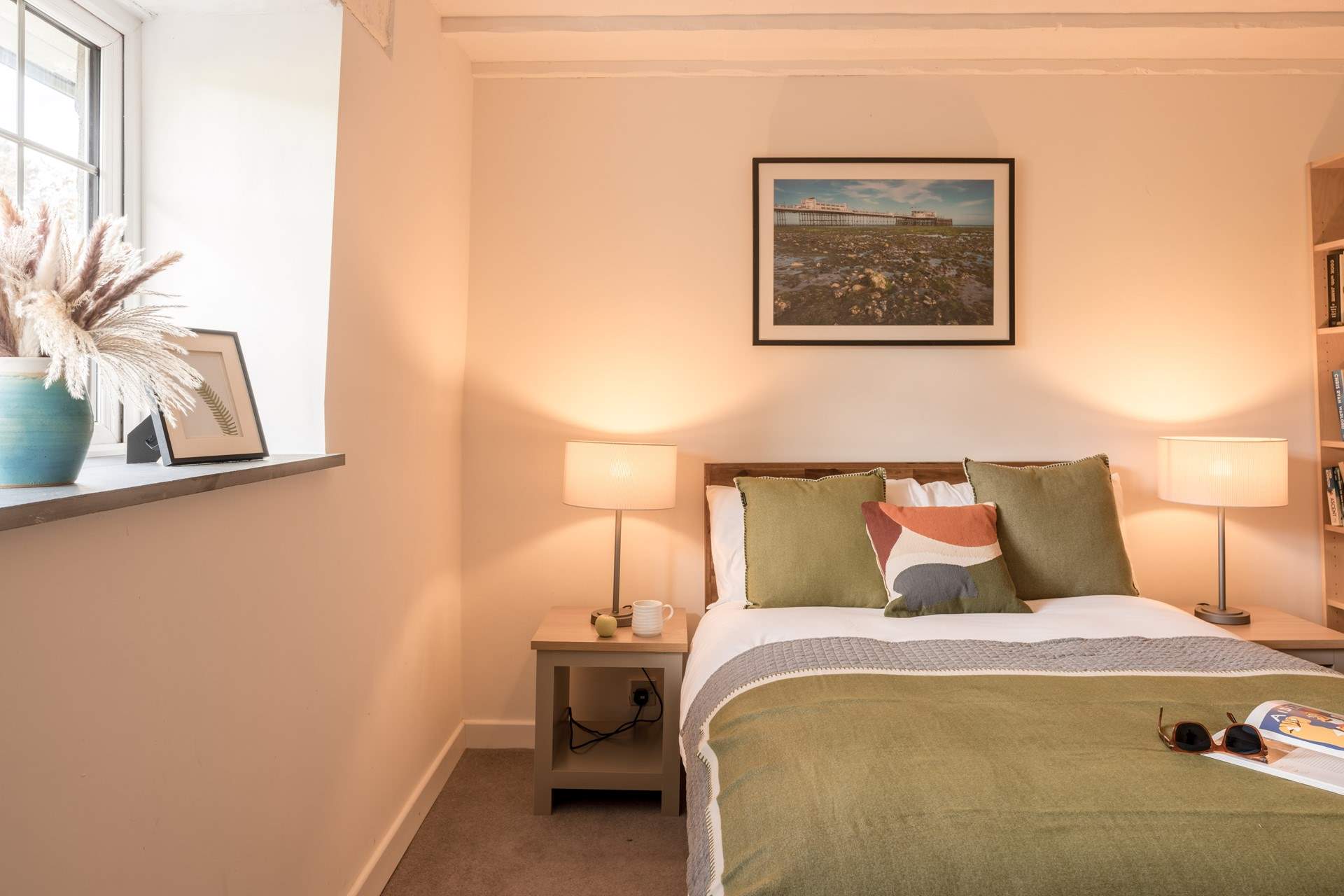 The bedroom looks out to the front across the trees and fields.