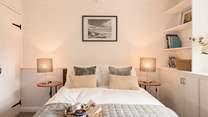 Bedroom 1 has a double bed with plenty of storage and a view out to the front.